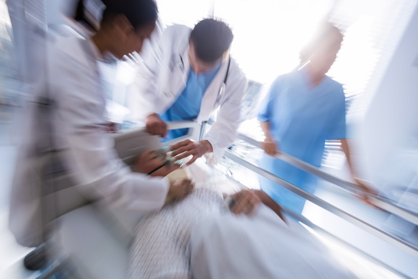 team-doctors-putting-oxygen-mask-male-senior-patient-face